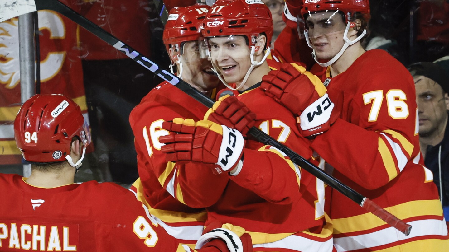 Flames beat Minnesota 4-2 to prevent the Wild from clinching a playoff spot