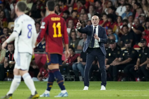 Spain coach Luis de la Fuente gestures during the Euro 2024 group A qualifying soccer match between Spain and Scotland at La Cartuja stadium in Seville, Spain, Thursday, Oct. 12, 2023. (AP Photo/Jose Breton)
