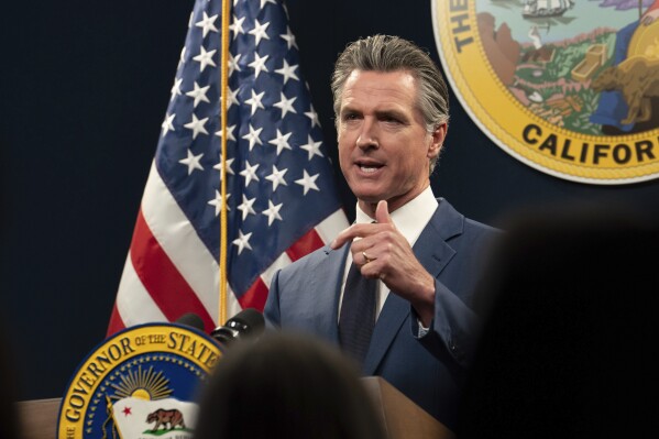  FILE - California Gov. Gavin Newsom answers a reporters question about his revised 2024-25 state budget during a news conference in Sacramento, Calif., Friday, May 10, 2024. Newsom used his State of the State address on Tuesday, June 25, 2024, to boost President Joe Biden ahead of Thursday's pivotal presidential debate,  comparing Donald Trump's version of the Republican Party to the rise of fascism prior to World War II and offering Democrats' ideals as "an antidote to the poisonous populism of the right. " (AP Photo/Rich Pedroncelli, File)