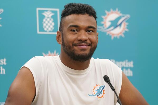 Miami Dolphins quarterback Tua Tagovailoa smiles during a news conference at the Dolphins NFL football training facility, Wednesday, April 20, 2022, in Miami Gardens, Fla. (AP Photo/Marta Lavandier)