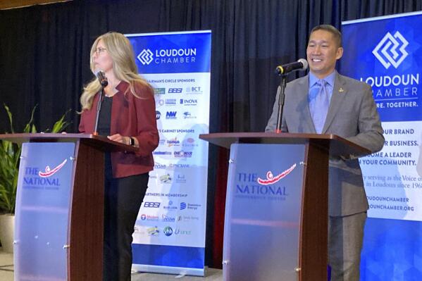 Incumbent U.S. Rep. Jennifer Wexton, D-Va, left, and Republican challenger Hung Cao participate in a debate, Thursday, Oct. 20, 2022, in Leesburg, Va. They are running to represent Virginia's 10th Congressional District. (AP Photo/Matthew Barakat)