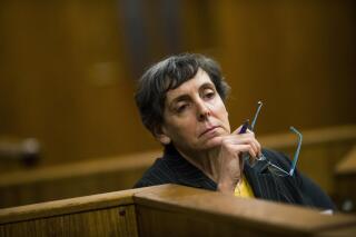 FILE-  Defendant Liane Shekter Smith listens during a preliminary examination in the cases of four defendants, all former or current officials from the Michigan Department of Environmental Quality, in Flint, Mich on Feb. 5, 2018. The state of Michigan said Friday, Nov. 5, 2021, it agreed to pay $300,000 to the only employee who was fired as a result of lead-contaminated water in Flint. The agreement with Liane Shekter Smith, who was head of the state’s drinking water division, came weeks after an arbitrator said she was wrongly fired in 2016 by officials who were likely looking for a “public scapegoat” in one of the worst environmental disasters in U.S. history. (Jake May/The Flint Journal via AP, File)