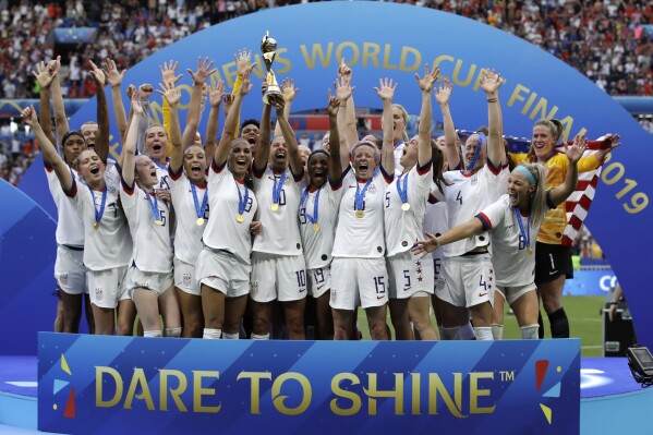 FILE - The United States' team celebrate with the trophy after winning the Women's World Cup final soccer match between against Netherlands at the Stade de Lyon in Decines, outside Lyon, France. (AP Photo/Alessandra Tarantino, File)