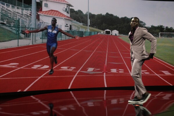 FILE - Issam Asinga, a track and field competitor, is introduced at the annual awards for high school athletes, on July 11, 2023, in Los Angeles. Asinga, the Florida teenager who beat Noah Lyles in a 100 meter race in April has been suspended for a positive doping test, track and field investigators said Friday Aug. 11, 2023. (AP Photo/Damian Dovarganes, File)