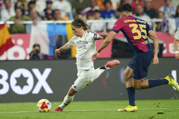 Real Madrid's Luka Modric in action during the Spanish Copa del Rey final soccer match between Barcelona and Real Madrid at Estadio de La Cartuja stadium in Seville, Spain, Saturday, April 26, 2025. (AP Photo/Jose Breton)