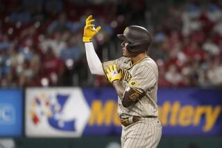 San Diego Padres' Manny Machado celebrates after hitting a double during the sixth inning of a baseball game against the St. Louis Cardinals Friday, Sept. 17, 2021, in St. Louis. (AP Photo/Jeff Roberson)