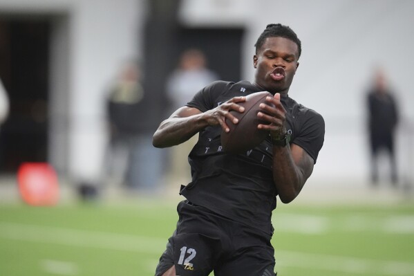 Travis Hunter and Shedeur Sanders put on a show for all 32 NFL teams at  Colorado's pro day | AP News