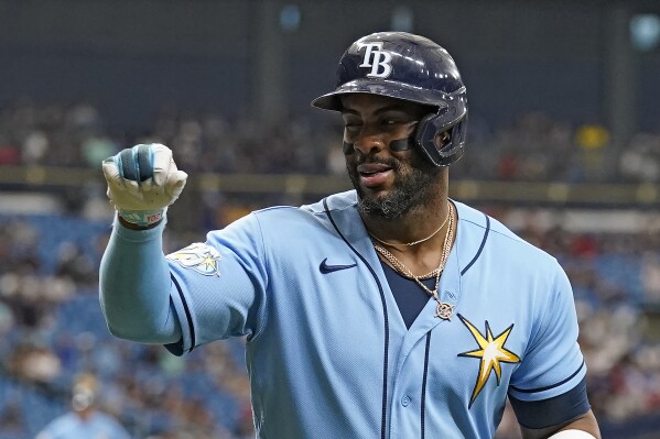 Tampa Bay Rays' Yandy Diaz reacts after his solo home run off Toronto Blue Jays starting pitcher Hyun Jin Ryu during the first inning of a baseball game Saturday, Sept. 23, 2023, in St. Petersburg, Fla. (AP Photo/Chris O'Meara)