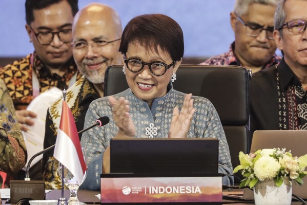 Indonesian Foreign Minister Retno Marsudi applauds during the opening of the Meeting of the Southeast Asia Nuclear Weapon Free Zone Commission at the Association of Southeast Asian Nations (ASEAN) Foreign Minister's Meeting in Jakarta, Indonesia, Tuesday, July 11, 2023. (Adi Weda/Pool Photo via AP)