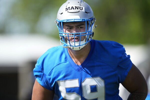 Detroit Lions offensive lineman Giovanni Manu is seen during an NFL rookie football practice, Friday, May 10, 2024, in Allen Park, Mich. (AP Photo/Carlos Osorio)