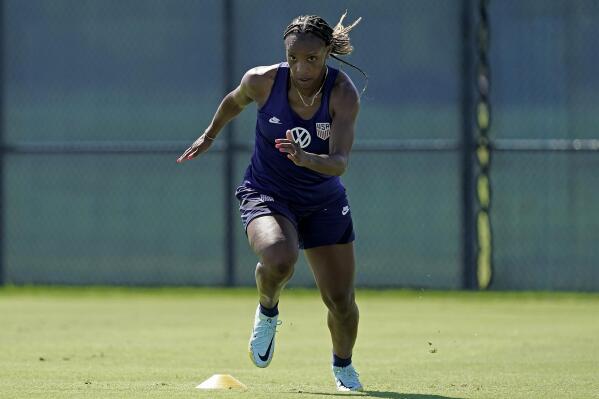 U.S. national team player Crystal Dunn takes part in a drill during practice for a match against Nigeria Tuesday, Aug. 30, 2022, in Riverside, Mo. Women’s soccer in the United States has struggled with diversity, starting with a pay-to-play model that can exclude talented kids from communities of color. (AP Photo/Charlie Riedel)