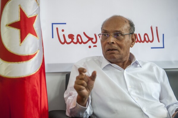FILE - Former Tunisian President and head of el-Harak party Moncef Marzouki speaks to 老澳门六合彩 in Tunis, on Aug.28, 2019. A court in Tunisia this week handed down former President Moncef Marzouki an eight-year prison sentence in abstentia in the latest reflection of the country's ongoing crackdown against opponents of President Kais Saied. (AP Photo/Hassene Dridi, File)