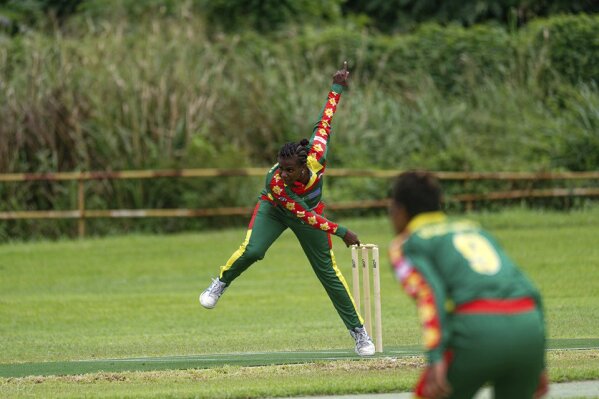 In this May, 2019, photo provided by the Vanuatu Cricket Association Selina Solman bowls during a women's cricket match in Port Vila, Vanuatu. The tropical island in the South Pacific is very likely to be the only venue in the world hosting a competitive cricket final on Saturday, as most international sport remains shuttered around the globe. (Ron Zwiers/Vanuatu Cricket Association via AP)