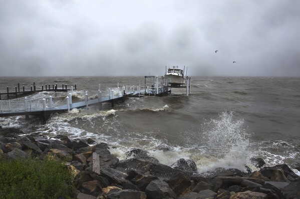 Waves generated by Tropical Storm Ophelia crash up on the banks of the Potomac River along Irving Avenue in the town of Colonial Beach in Westmoreland County, Va., on Saturday, Sept. 23, 2023. (Peter Cihelka/The Free Lance-Star via AP)