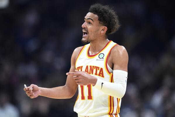 Atlanta Hawks guard Trae Young reacts to a foul call during the first half of the team's NBA play-in basketball game against the Cleveland Cavaliers on Friday, April 15, 2022, in Cleveland. (AP Photo/Nick Cammett)