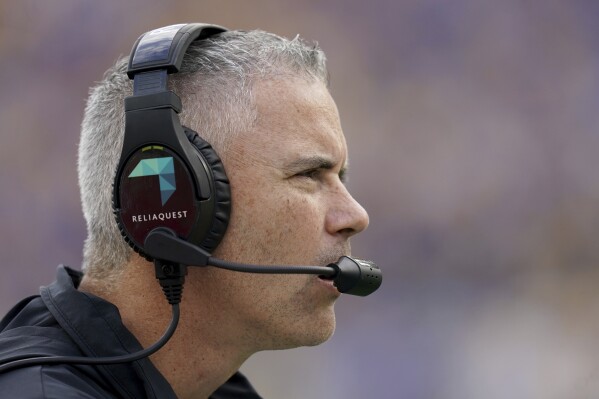 Florida State head coach Mike Norvell stands on the sideline during the first half of an NCAA college football game against Pittsburgh in Pittsburgh, Saturday, Nov. 4, 2023. (AP Photo/Matt Freed)