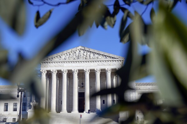 The U.S Supreme Court is photographed on Friday, Jan. 5, 2024, in Washington. The Supreme Court will decide whether former President Donald Trump can be kept off the 2024 presidential ballot because of his efforts to overturn his 2020 election loss that culminated in the U.S. Capitol attack. The justices Friday agreed to take a Colorado case, inserting themselves in the presidential campaign and acknowledging the need to decide quickly. (AP Photo/Mariam Zuhaib)