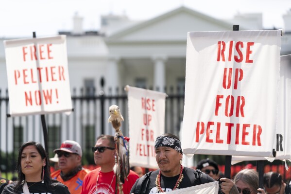 People gather for a rally outside of the White House in support of imprisoned Native American activist Leonard Peltier, Tuesday, Sept. 12, 2023, in Washington. (AP Photo/Stephanie Scarbrough)