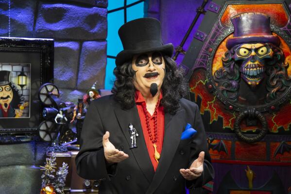 This image released by MeTv shows Rich Koz, dressed as horror movie host on MeTV's “Svengoolie.” (Jim Roche/MeTV via AP)