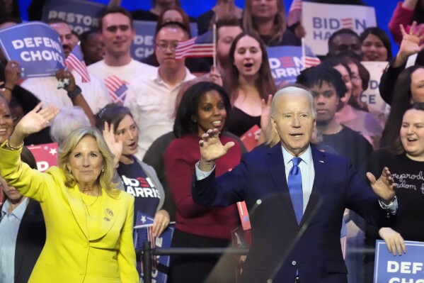President Joe Biden is joined on stage by first lady Jill Biden at an event on the campus of George Mason University in Manassas, Va., Tuesday, Jan. 23, 2024, to campaign for abortion rights, a top issue for Democrats in the upcoming presidential election. (AP Photo/Alex Brandon)