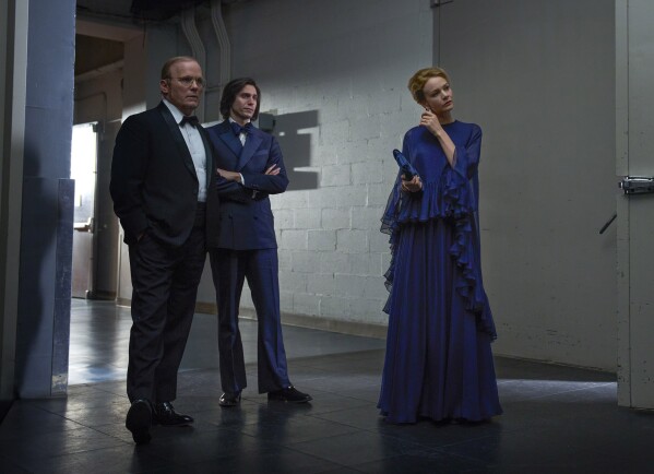 This image released by Netflix shows Scott Ellis as Harry Kraut, from left, Gideon Glick as Tommy Cothran and Carey Mulligan as Felicia Montealegre on the set of "Maestro." (Jason McDonald/Netflix via AP)