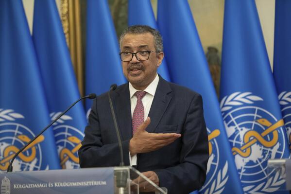 Director-General of the World Health Organization Tedros Adhanom Ghebreyesus, left, speaks during a joint press conference with Hungarian Minister of Foreign Affairs and Trade Peter Szijjarto after their talks in the ministry in Budapest, Hungary, Monday, Aug. 23, 2021. (Balazs Mohai/MTI via AP)