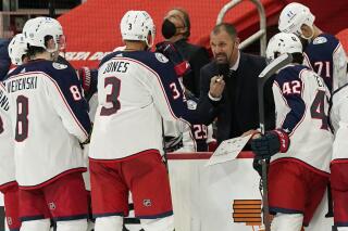 FILE - In this March 27, 2021, file photo, Columbus Blue Jackets assistant coach Brad Larsen talks to the team during the third period of an NHL hockey game against the Detroit Red Wings in Detroit. The Blue Jackets on Thursday, June 10, promoted Larsen to fill the head coaching vacancy left after Columbus parted ways with John Tortorella after six seasons. (AP Photo/Carlos Osorio, File)