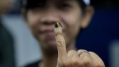 A woman shows her finger inked to mark that she has already voted during the election in Jakarta, Indonesia, Wednesday, Feb. 14, 2024. Millions of Indonesians were choosing a new president Wednesday as the world's third-largest democracy aspires to become a global economic powerhouse just over 25 years since emerging from a brutal authoritarian era. (AP Photo/Dita Alangkara)