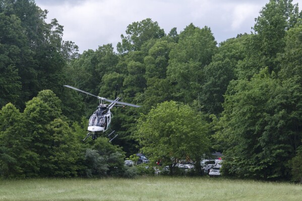 A helicopter takes flight near the site of a plane crash where three people were killed Wednesday, May 15, 2024, in Leipers Fork, Tenn. The plane departed from Baton Rouge, La., and was headed to Louisville, Ky., when it crashed. (Nicole Hester/The Tennessean via AP)