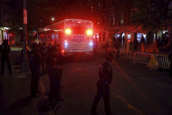 A police bus carrying arrested protesters at Columbia University in New York departs from the campus entrance on 114th Street, Tuesday, April 30, 2024. After entering campus, a squad of police officers approached Hamilton Hall, the administrative building that student demonstrators had begun occupying in the morning.  (AP Photo/Julius Mortal)