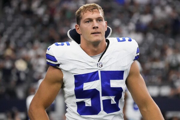 FILE - Dallas Cowboys linebacker Leighton Vander Esch walks on the field before an NFL football game against the New York Jets, Sunday, Sept. 17, 2023 in Arlington, Texas. Leighton Vander Esch retired Monday, March 18, 2024, after six NFL seasons, with the linebacker stepping away after missing 12 games for the Dallas Cowboys last year because of the latest in a series of neck injuries.(AP Photo/Sam Hodde, File)