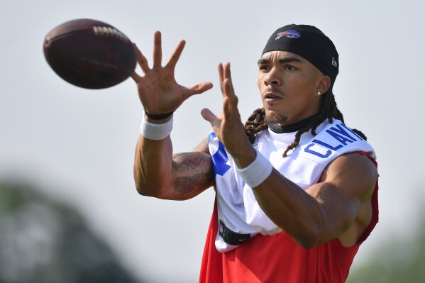 FILE - Buffalo Bills wide receiver Chase Claypool (14) catches a pass during an NFL football training camp practice in Pittsford, N.Y., Wednesday, July 24, 2024. (AP Photo/Adrian Kraus, File)