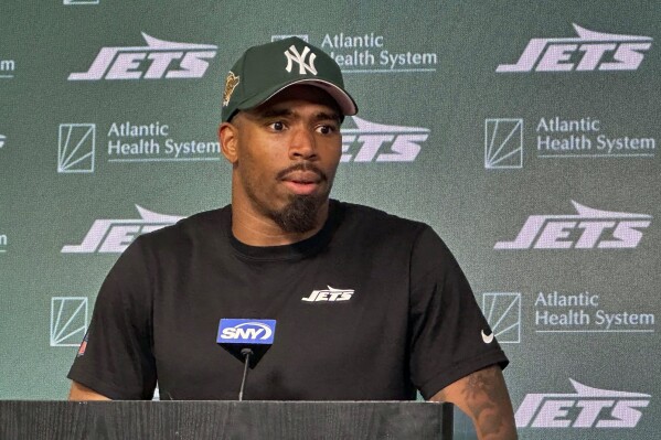 New York Jets safety Chuck Clark speaks with reporters at the NFL football team's facility in Florham Park, N.J., Tuesday, June 4, 2024. (AP Photo/Dennis Waszak Jr.)