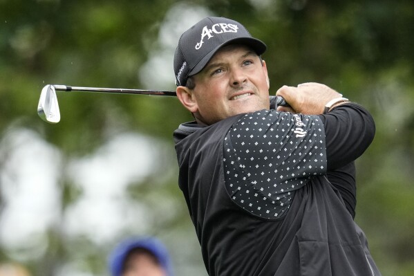 FILE - Patrick Reed watches his tee shot on the fourth hole during the weather delayed third round of the Masters golf tournament at Augusta National Golf Club on Saturday, April 8, 2023, in Augusta, Ga. Reed has yet to receive a PGA Championship invitation. He has not missed a major since the 2014 Masters. (AP Photo/Mark Baker)