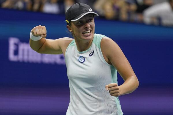 Iga Swiatek, of Poland, reacts after defeating Aryna Sabalenka, of Belarus, during the semifinals of the U.S. Open tennis championships, Thursday, Sept. 8, 2022, in New York. (AP Photo/Charles Krupa)