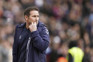 Everton manager Frank Lampard looks on during the English Premier League soccer match between West Ham United and Everton at the London Stadium, London, Sunday, April 3, 2022. (Mike Egerton/PA via AP)