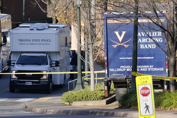 A Virginia State Police crime scene investigation truck is on the scene of an overnight shooting at the University of Virginia, Monday, Nov. 14, 2022, in Charlottesville. Va. (AP Photo/Steve Helber)