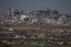 Destroyed farms and buildings in the Gaza Strip as seen from Southern Israel, Friday, Dec. 22, 2023. (AP Photo/Leo Correa)