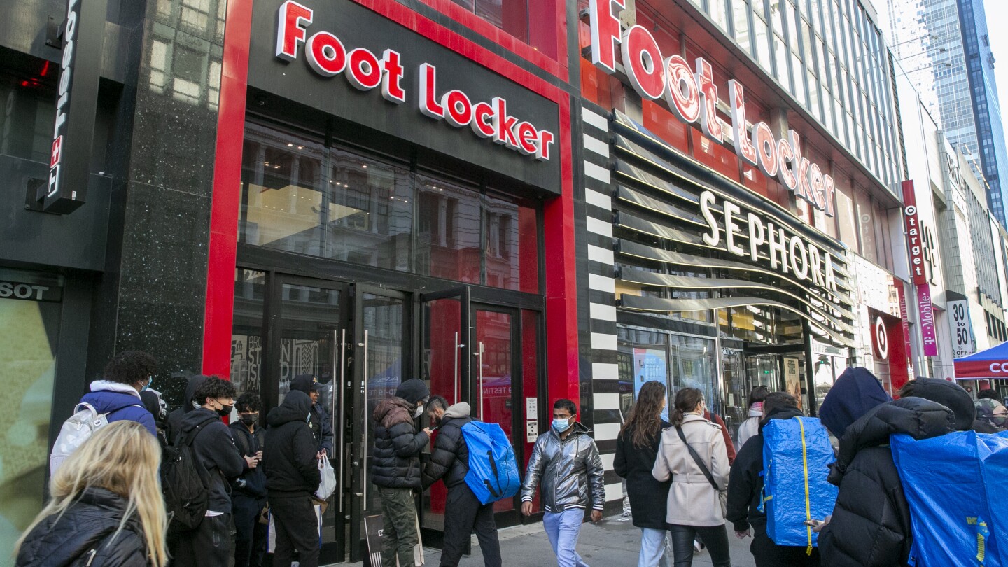 Foot Locker lowers full-year outlook again, pauses dividend as 2Q sales  fall on cautious consumers
