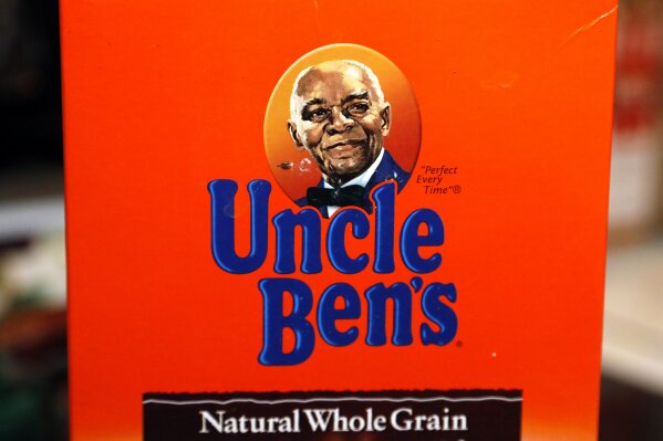 The portrait of "Uncle Ben's" is portrayed on a box of rice Thursday, June 18, 2020 in Jackson, Miss. The Uncle Ben's rice brand is getting a new name: Ben's Original. Parent firm Mars Inc. unveiled the change Wednesday, Sept. 23, 2020 for the 70-year-old brand, the latest company to drop a logo criticized as a racial stereotype. Packaging with the new name will hit stores next year. (AP Photo/Rogelio V. Solis)