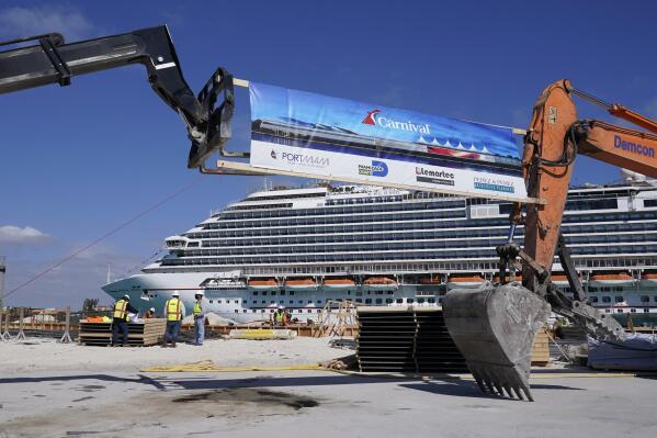 n this Friday, Jan. 29, 2021 photo, The Carnival Dream cruise ship arrives as construction work is underway for Carnival Cruise Line's new Terminal F, which will be the homeport to the Carnival Celebration cruise ship at PortMiami, in Miami. Cruise companies are adapting to a changing landscape amid a rise in COVID-19 cases that is threatening to dampen the industry’s comeback.(AP Photo/Lynne Sladky)