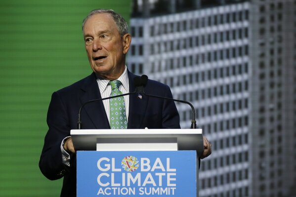 FILE  - In this Thursday, Sept. 13, 2018 file photo, Michael Bloomberg, the UN Secretary-General's Special Envoy for Climate Action, speaks during the plenary session of the Global Action Climate Summit, in San Francisco. The United Nations says American billionaire Michael Bloomberg has been reappointed as a special envoy to engage governments and businesses in tackling the threat of global warming. Bloomberg was first tapped for the position in 2018. The U.N. said Friday, Feb. 5, 2021 that Secretary-General Antonio Guterres wants the former New York City mayor to “mobilize stronger and more ambitious climate action” in the lead-up to a global climate summit in November. The summit was delayed by a year due to the coronavirus pandemic. (AP Photo/Eric Risberg, File)