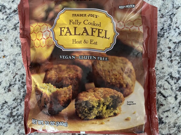 A bag of Trader Joes' falafel rests on a counter Saturday, July 29, 2023, in Royersford, Pa. Trader Joe's is recalling a broccoli cheddar soup that may contain insects and cooked falafel that may contain rocks, about one week after the grocery chain recalled two cookie products over similar concerns. (AP Photo)