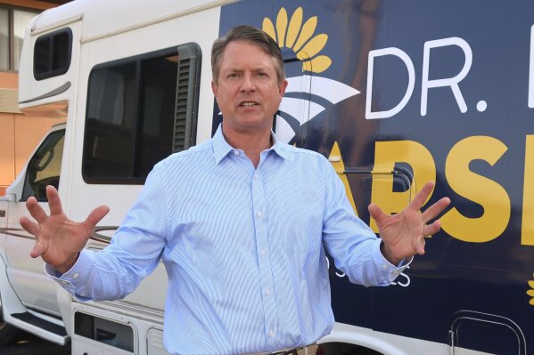 FILE - In this Sept. 5, 2019 file photo, U.S. Rep. Roger Marshall, R.-Kan., speaks to an Associated Press reporter outside an RV he uses in traveling the state, during a visit to Topeka, Kansas. The western Kansas congressman has launched a bid for an open U.S. Senate seat. (AP Photo/John Hanna,File)