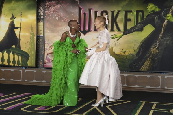 FILE - Cynthia Erivo, left, and Ariana Grande arrive at the premiere of 'Wicked' at the Dorothy Chandler Pavilion in Los Angeles, Nov. 9, 2024. (Photo by Jordan Strauss/Invision/AP File)