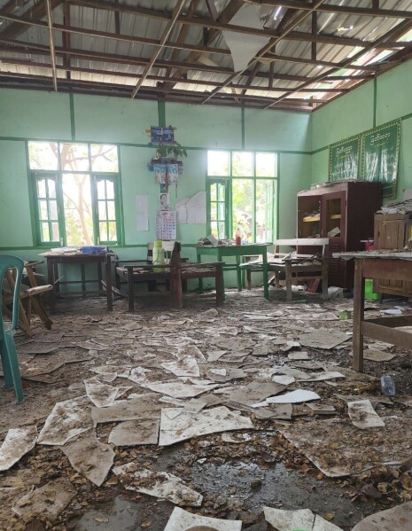 A room of a high school is seen filled with debris after it was allegedly hit by an airstrike by the military in Ohe Htein Twin village in Tabayin township, also known as Depayin in Sagaing region, Myanmar, Monday, May 12, 2025. (White Depeyin People Defence Force via AP)