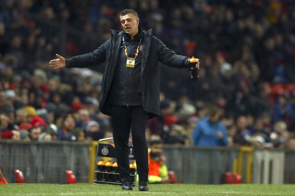 FILE - Partizan's head coach Savo Milosevic gestures during the Europa League group L soccer match between Manchester United and FK Partizan at Old Trafford Stadium in Manchester, England, on Nov. 7, 2019. There was a hat trick of European Championship qualifications this week for soccer teams from the former Yugoslavia. Now Bosnia-Herzegovina aims to make it a record four in Germany next year. Serbia, Slovenia and Croatia all qualified between Sunday and Tuesday. The sense of history was appreciated Thursday by Bosnia’s coach Savo Milošević. (AP Photo/Dave Thompson)