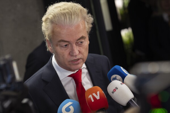 FILE - Geert Wilders, leader of the far-right party PVV, or Party for Freedom, talks to the media after a meeting with speaker of the House Vera Bergkamp, two days after Wilders won the most votes in a general election, in The Hague, Netherlands, on Nov. 24, 2023. Two days of behind-closed doors talks between four Dutch political leaders appear to have forced a breakthrough in negotiations to form a new ruling coalition nearly four months after a general election won by Wilders. While the exact contours of a new coalition Cabinet remain unclear, Kim Putters, who led the talks, believes that the parties are now ready to hammer out a deal. Putters was writing up a report Wednesday March 13, 2024 that he will present to lawmakers on Thursday. (AP Photo/Peter Dejong, File)