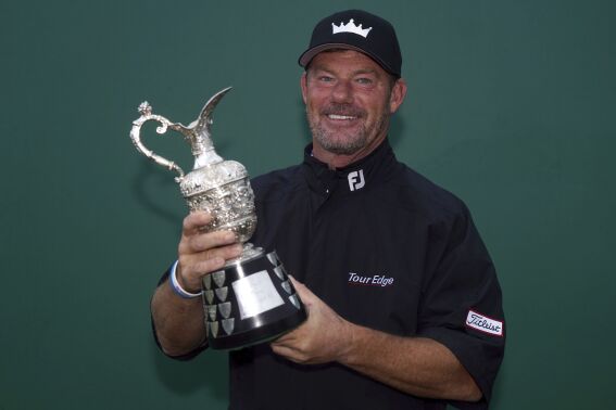 Germany's Alex Cejka poses with the trophy after winning the Senior Open Championship at the Royal Porthcawl Golf Course, Porthcawl, Wales, Sunday July 30, 2023. (Nick Potts/PA via AP)