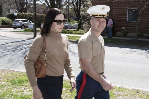 FILE - Marine Maj. Joshua Mast and his wife, Stephanie, arrive at Circuit Court, Thursday, March 30, 2023 in Charlottesville, Va. The U.S. government has warned a Virginia judge that allowing Marine Maj. Joshua Mast and his wife to keep an Afghan war orphan risks violating international law and could be viewed around the world as “endorsing an act of international child abduction,” according to secret court records reviewed by . (AP Photo/Cliff Owen, File)